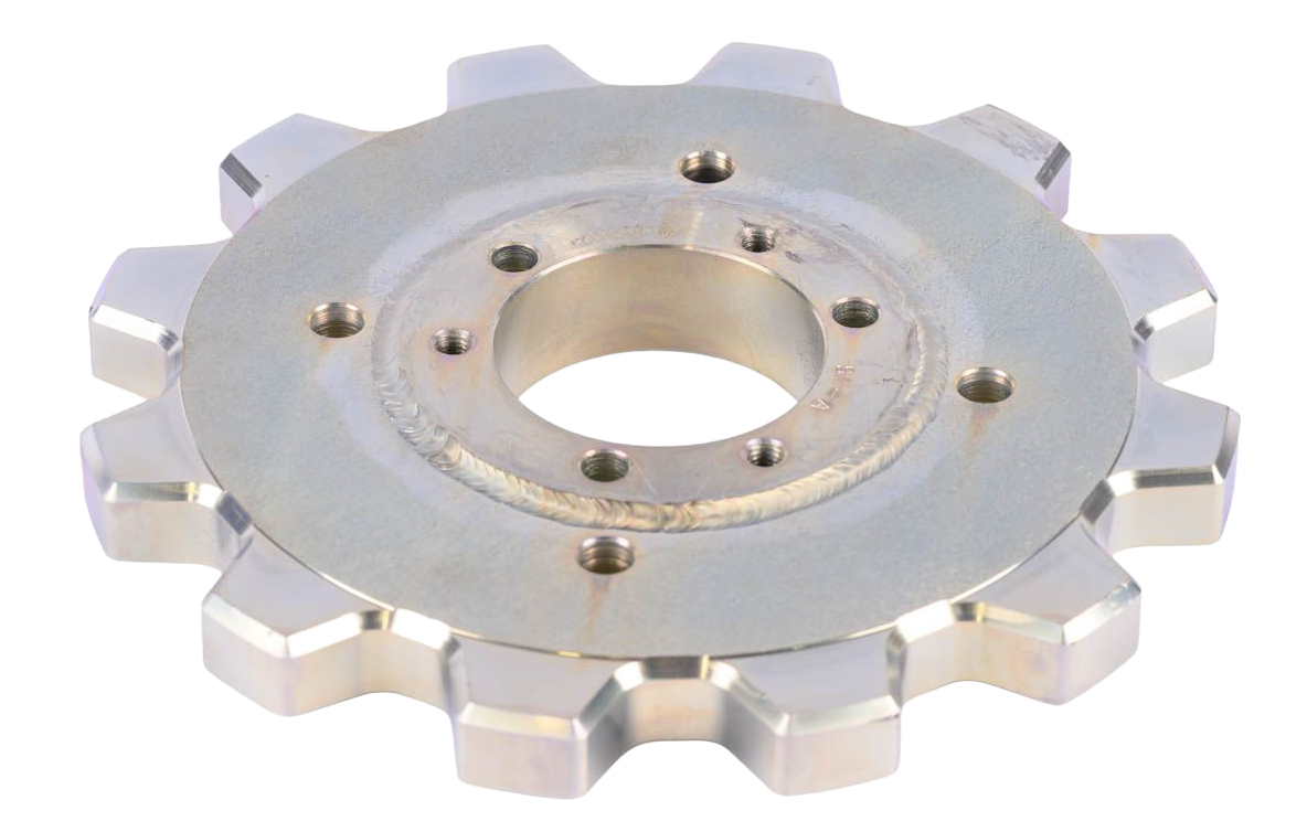 Silver sprocket wheel with gear teeth and central hole, featuring mounting holes.