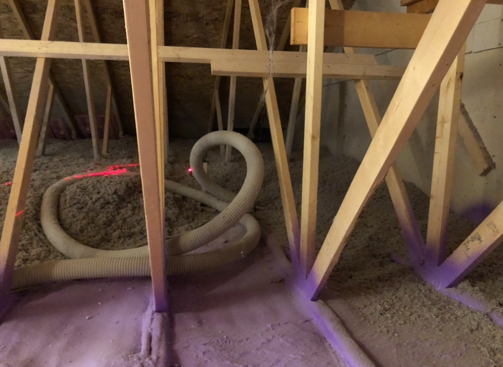 A wooden structure with a snake in the middle of it