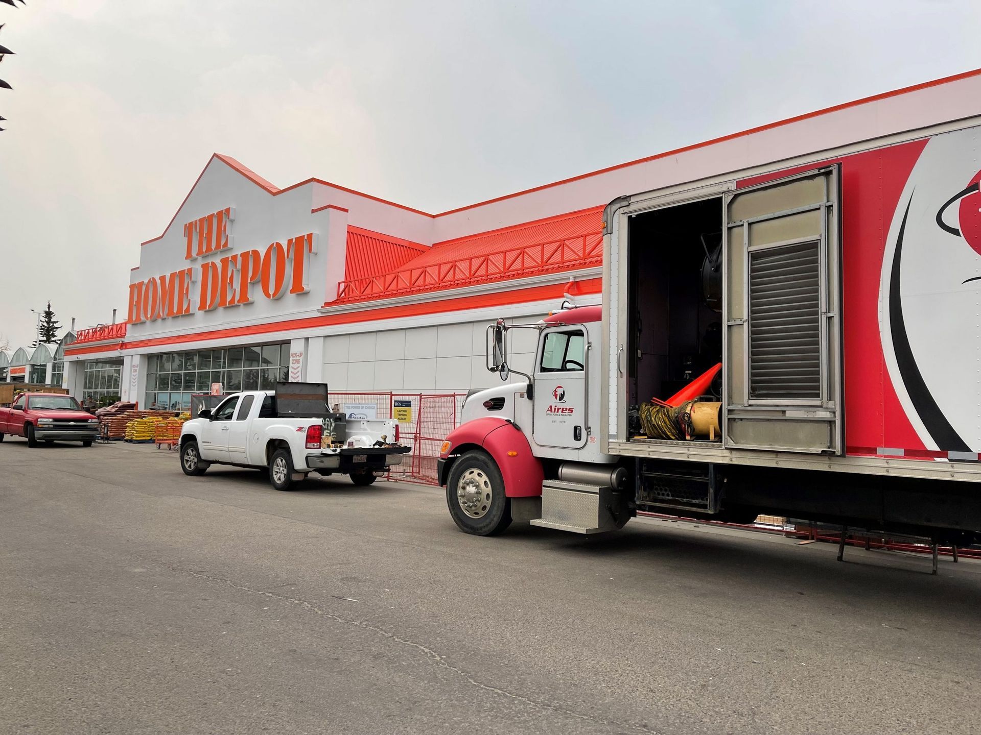 A truck is parked in front of a home depot