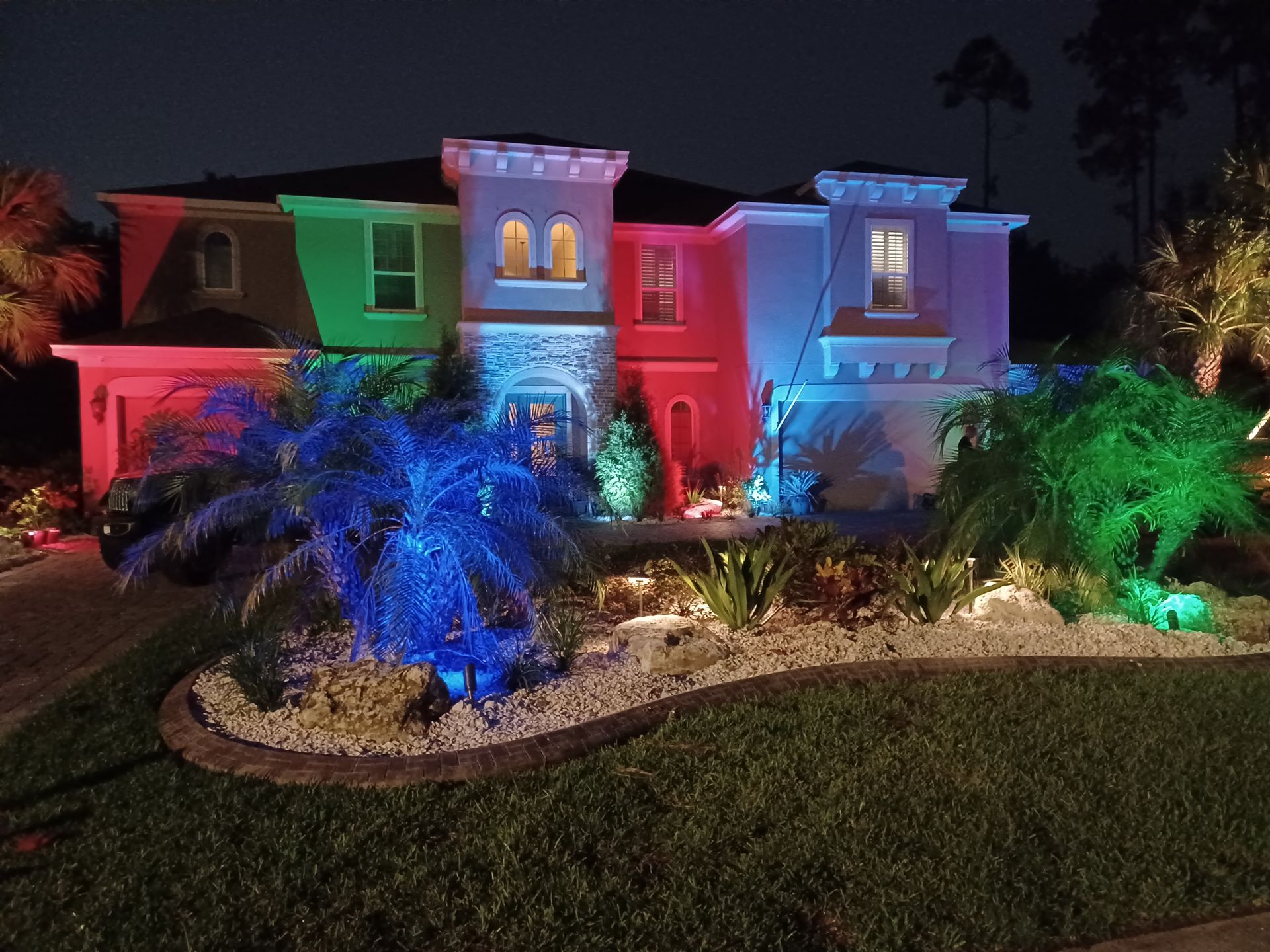 A house with a lot of lights on it at night