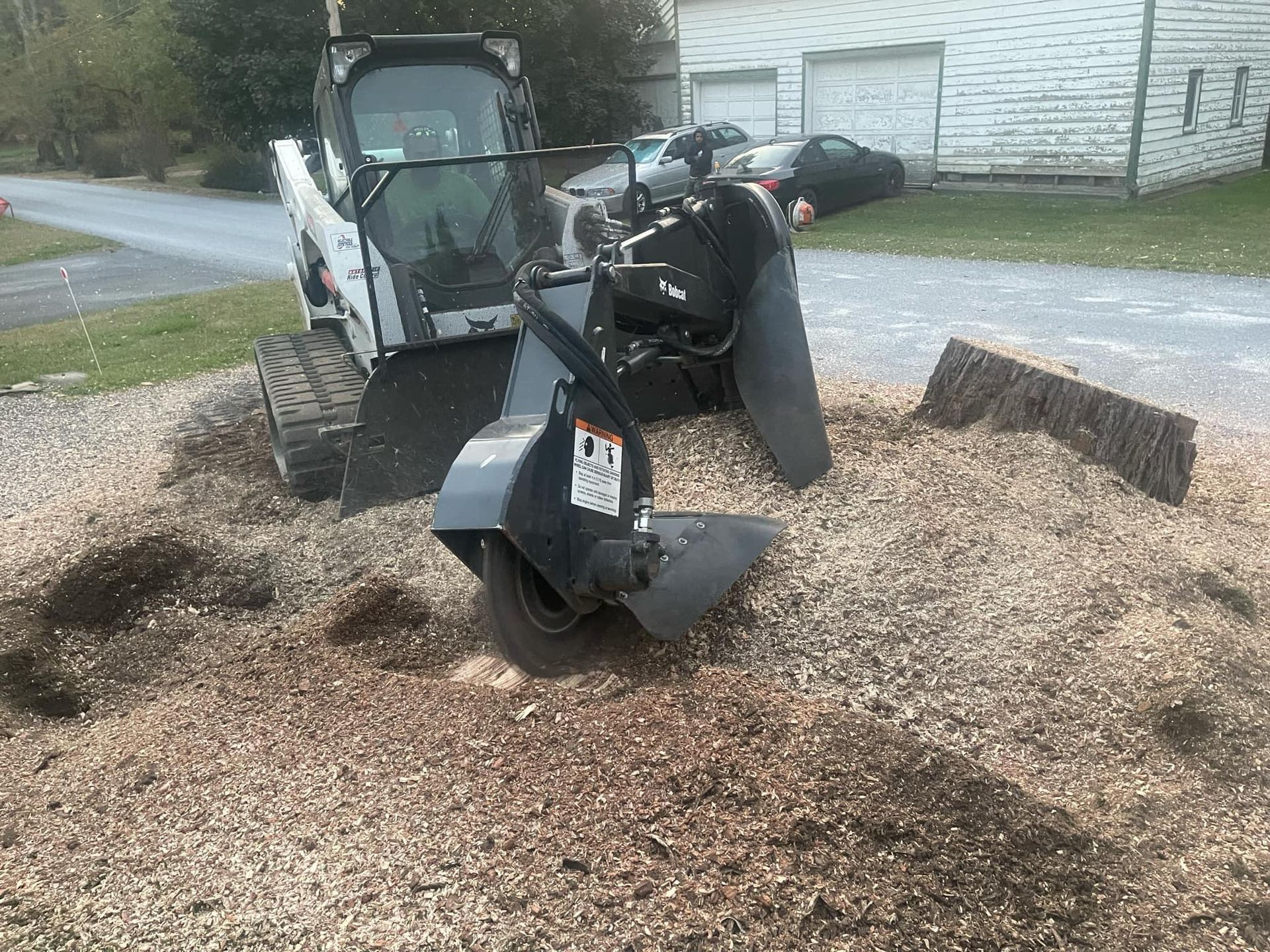 A stump grinder is being used to remove a tree stump.