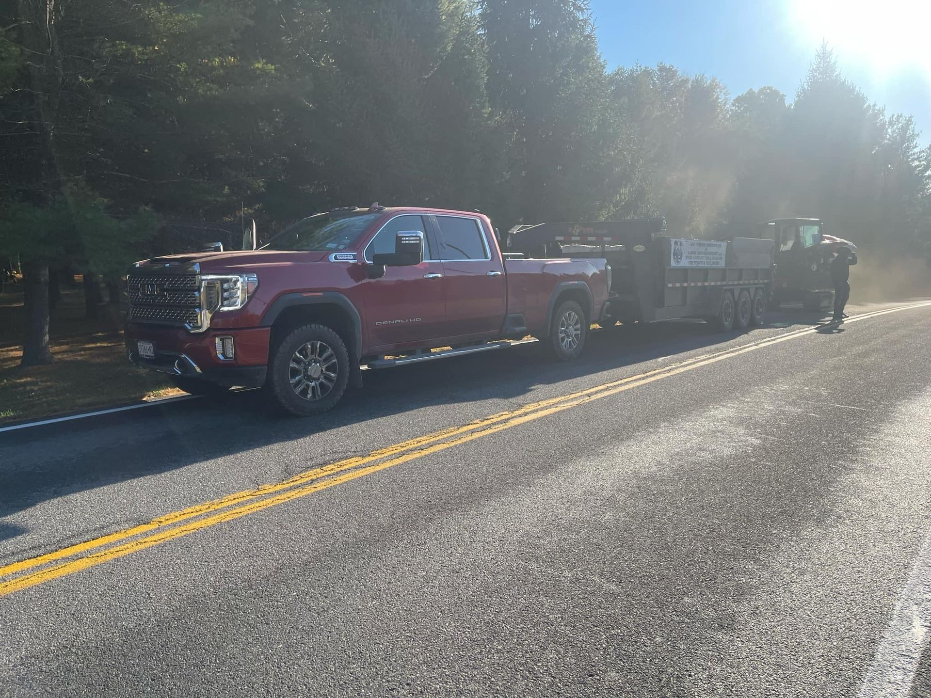 A red truck is parked on the side of the road