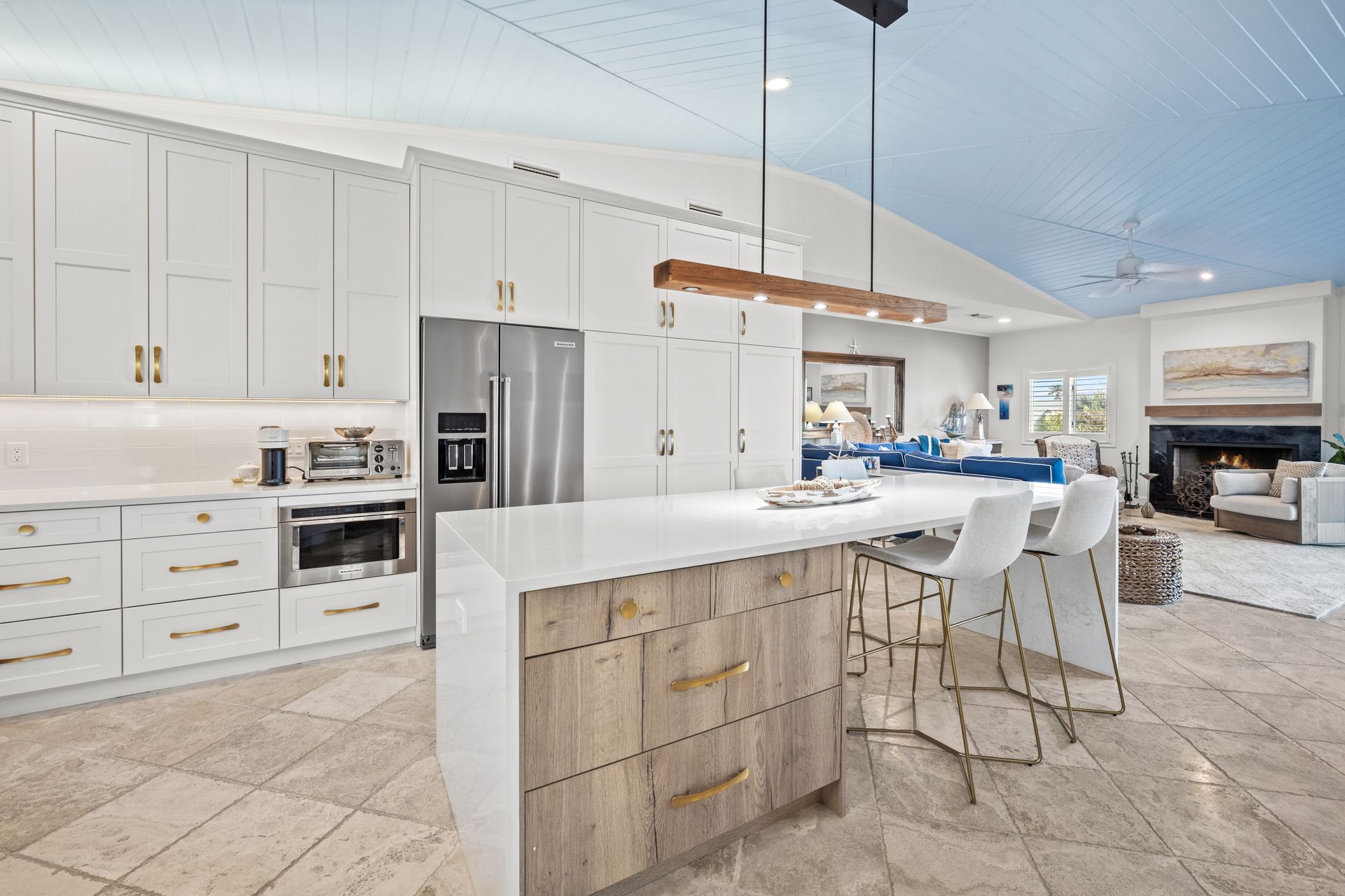 There is a large island in the middle of the kitchen.