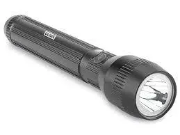 A black flashlight is sitting on a white surface.