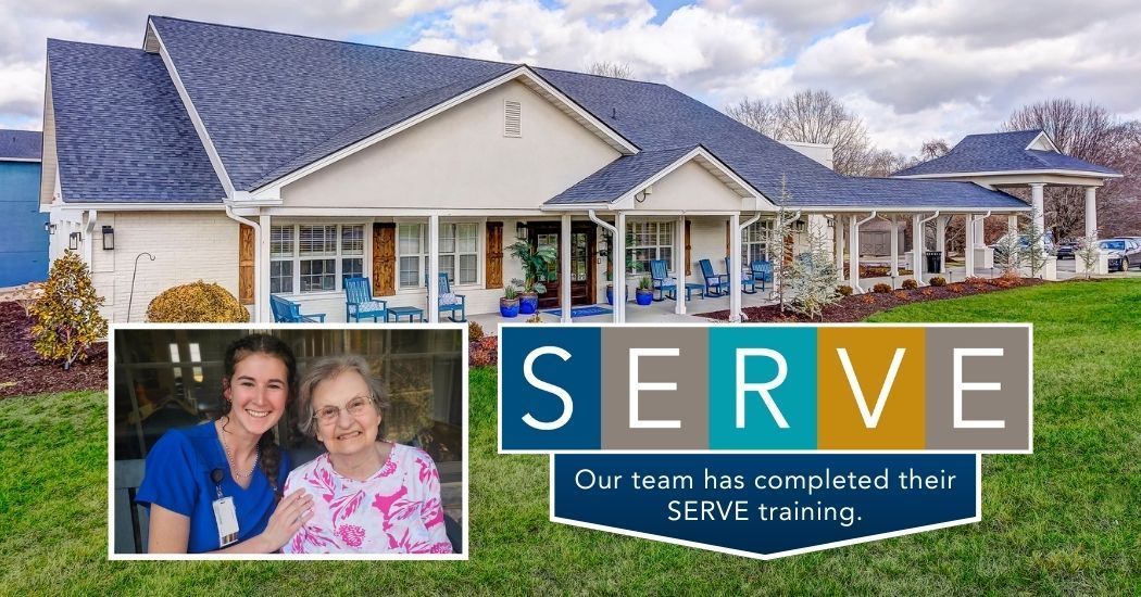 Two women are standing in front of a house with a sign that says serve.