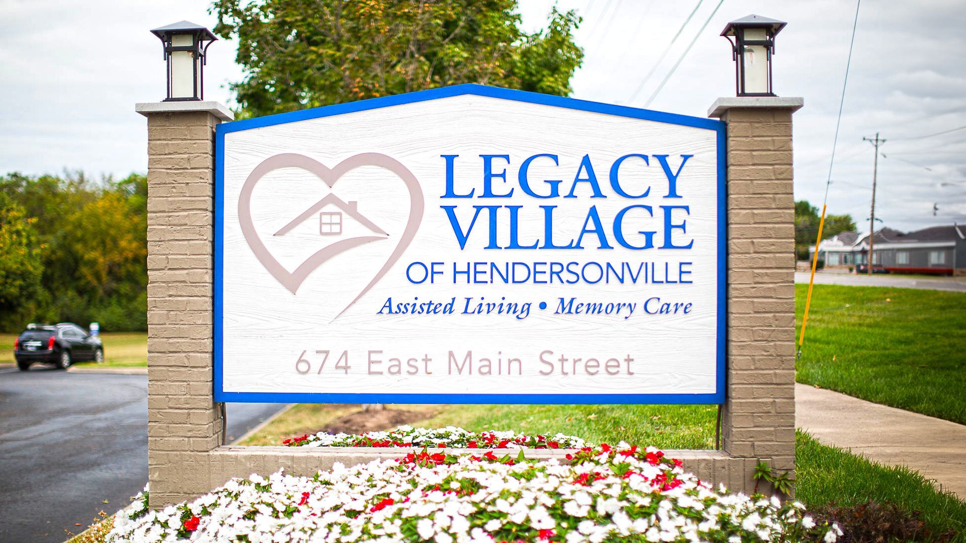 A sign for legacy village of hendersonville animal living memory care