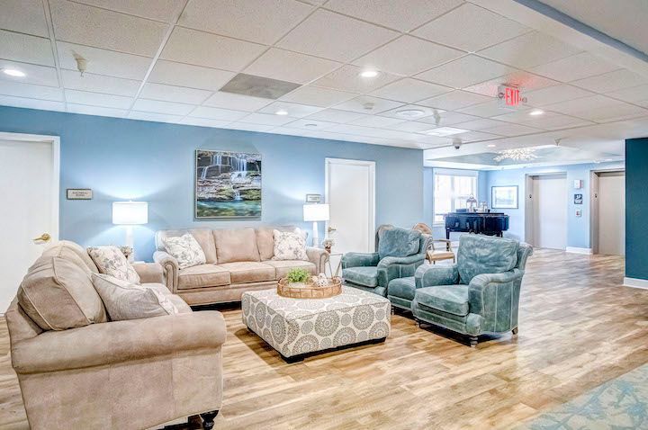 A living room filled with furniture and a table.