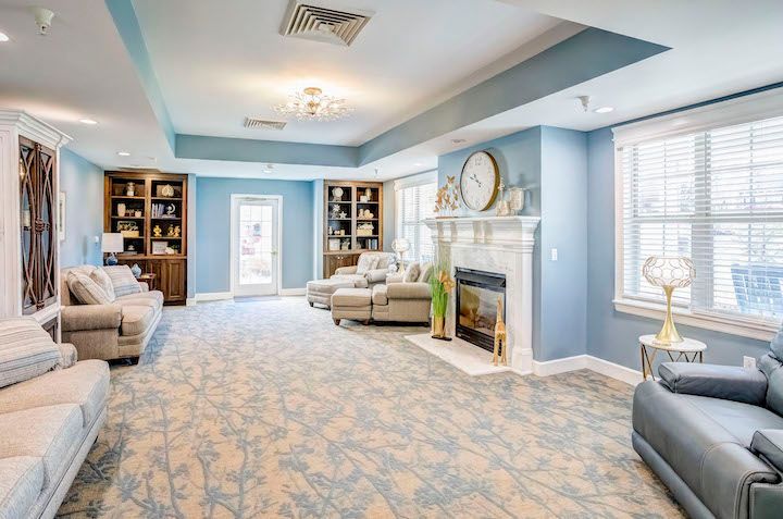 A living room filled with furniture and a fireplace.