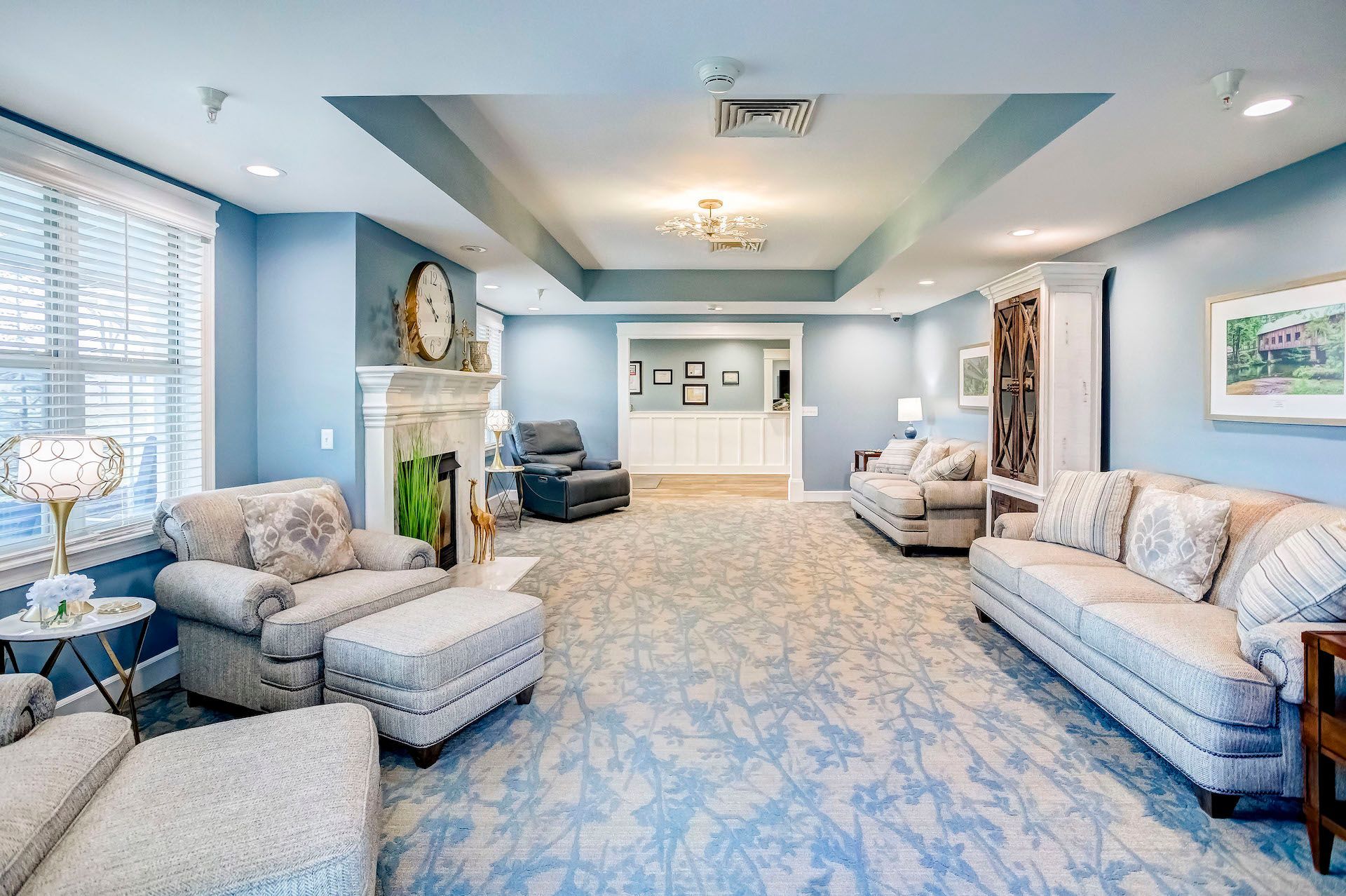 A living room filled with furniture and a fireplace.