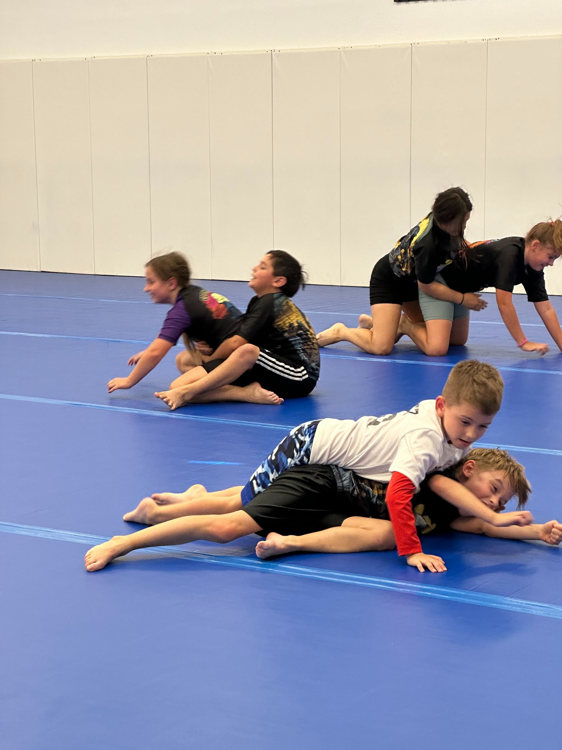 Children learning grappling skills at Vacaville Grappling Academy to build confidence and life skills