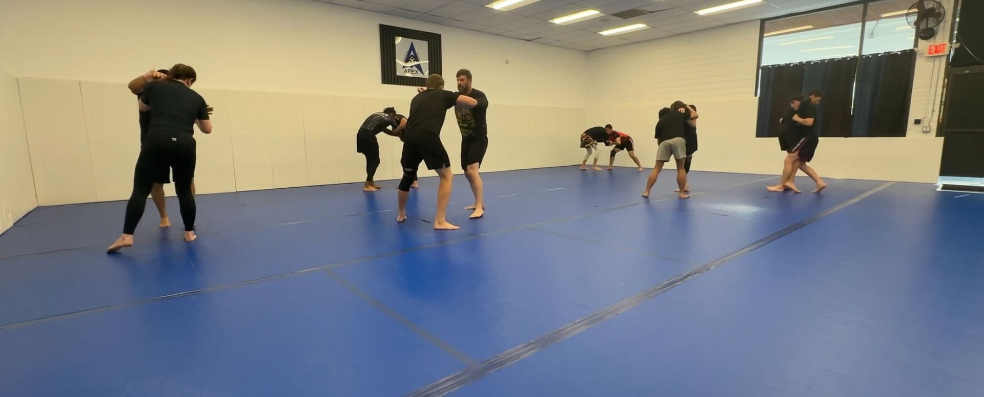 Adults drilling Brazilian Jiu-Jitsu at Vacaville Grappling Academy in Vacaville, CA for strength.