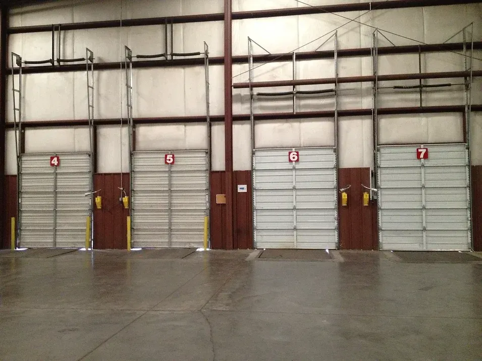 A row of garage doors with numbers 4, 5, 6 and 7 on them
