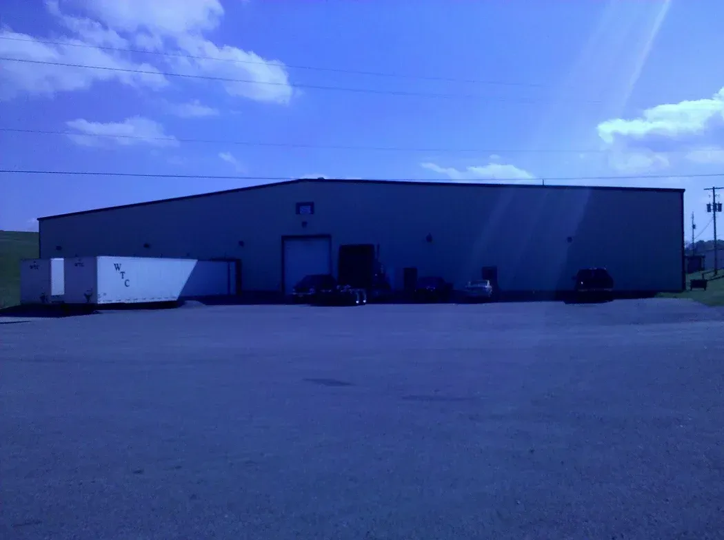 A large building with a blue sky in the background