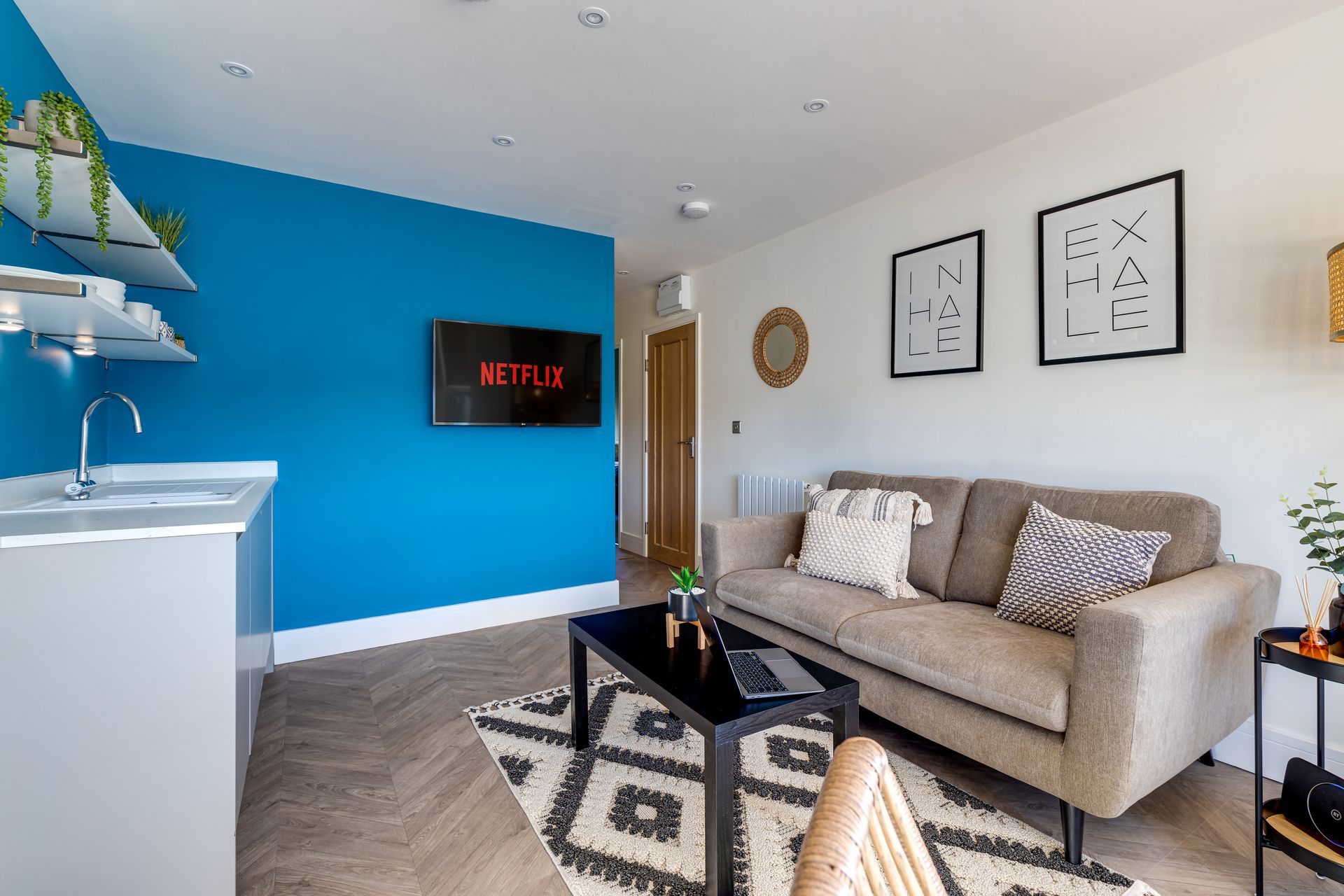 A living room with a couch , table , and television.