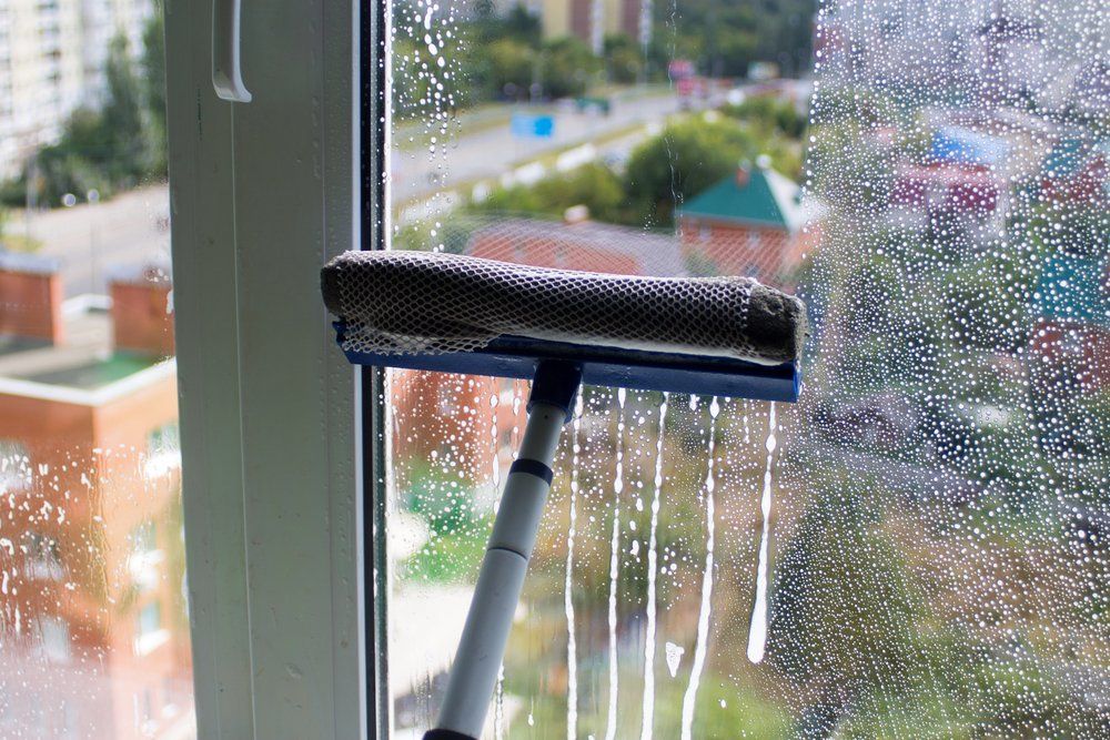 Cleaning Window With Brush — DS Cleaning Services in Sunshine Coast, QLD
