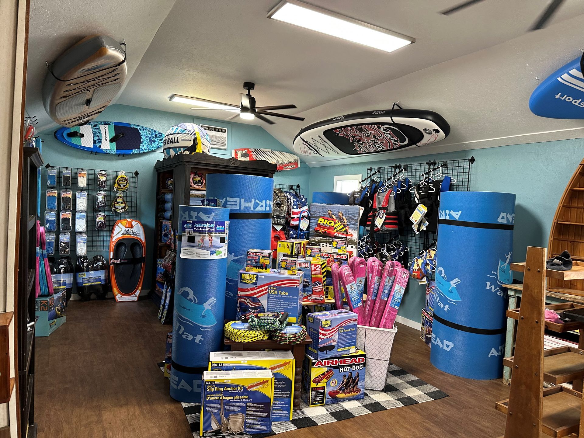 A store filled with lots of toys and surfboards.