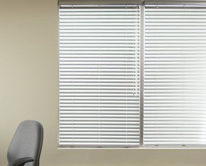 Plain perfect fit blinds in an office