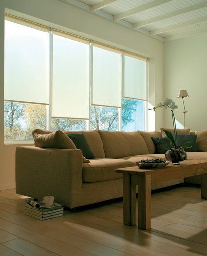 A set of 4 roller blinds in a front room
