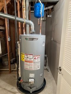 A person is using a smart phone to control a thermostat.