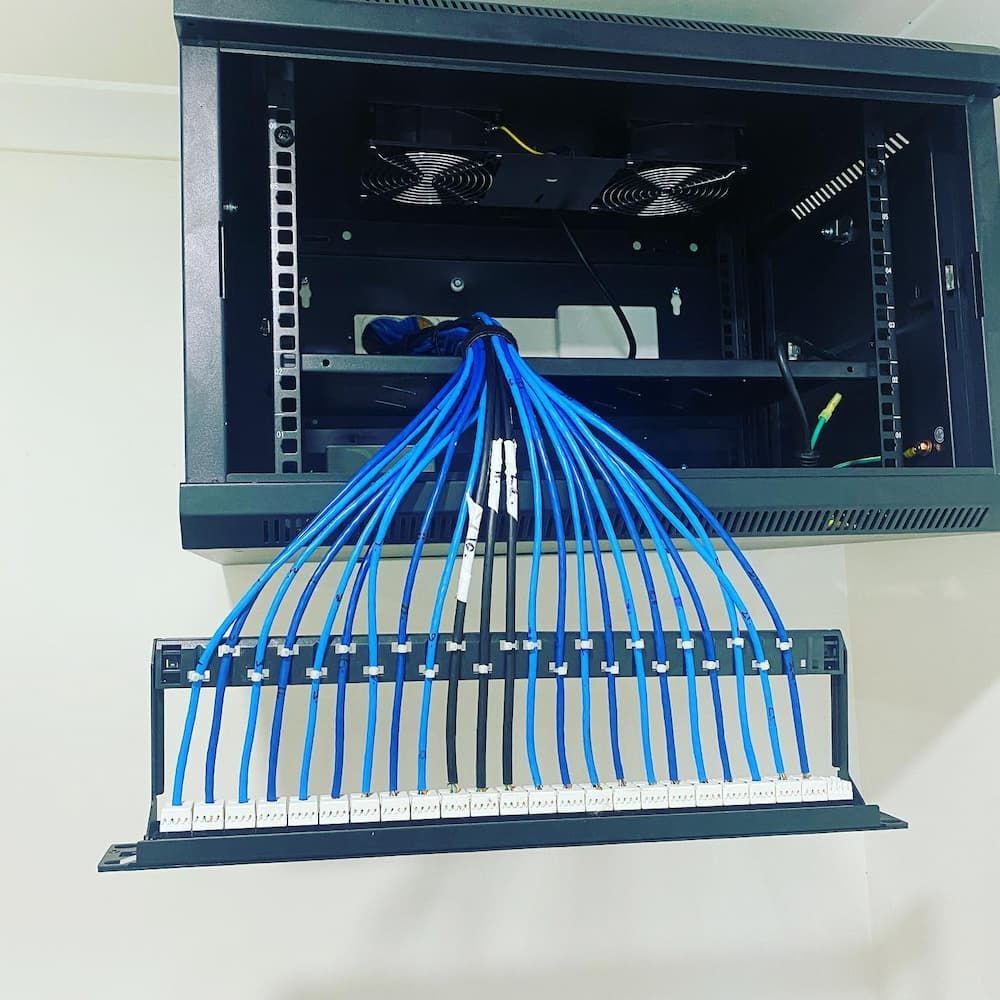 A Rack with A Bunch of Wires Coming out Of It — Higgins Electrical in Bribie Island, QLD