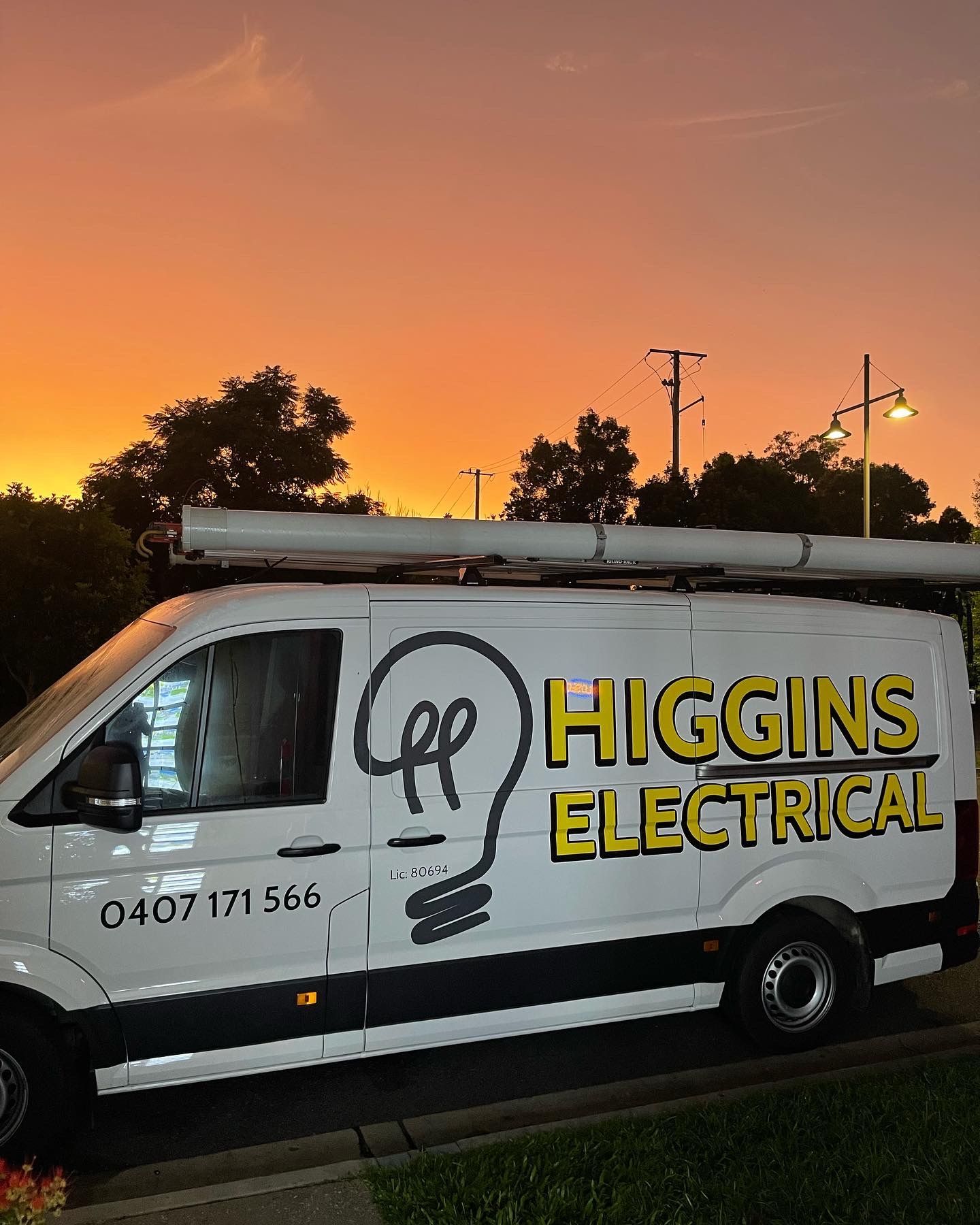 White Higgins Electrical van with logo parked at sunset — Higgins Electrical in Beerwah, QLD