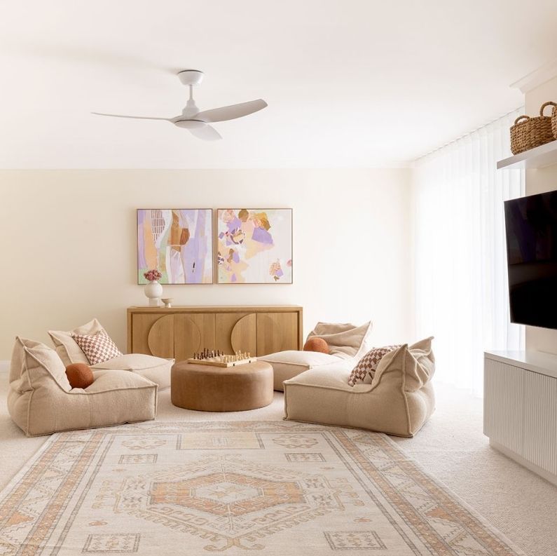 A Ceiling Fan with Wooden Blades Is Hanging from The Ceiling — Higgins Electrical in Beerwah, QLD