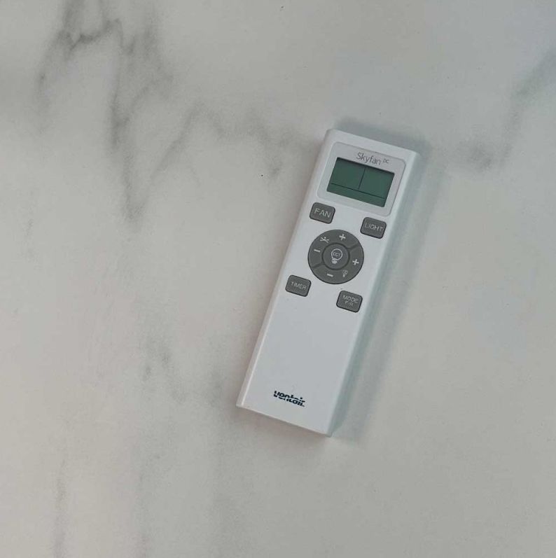 A Man Is Working on An Electrical Box with A Multimeter — Higgins Electrical in Beerwah, QLD