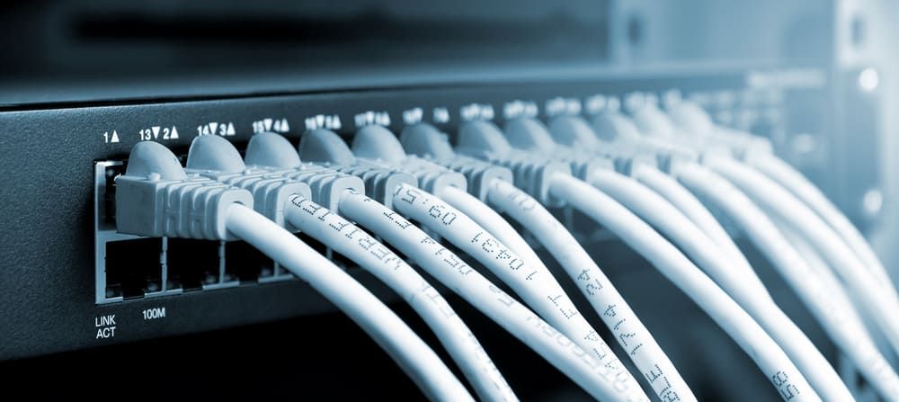 A Bunch of Wires Are Connected to A Server — Higgins Electrical in Narangba, QLD