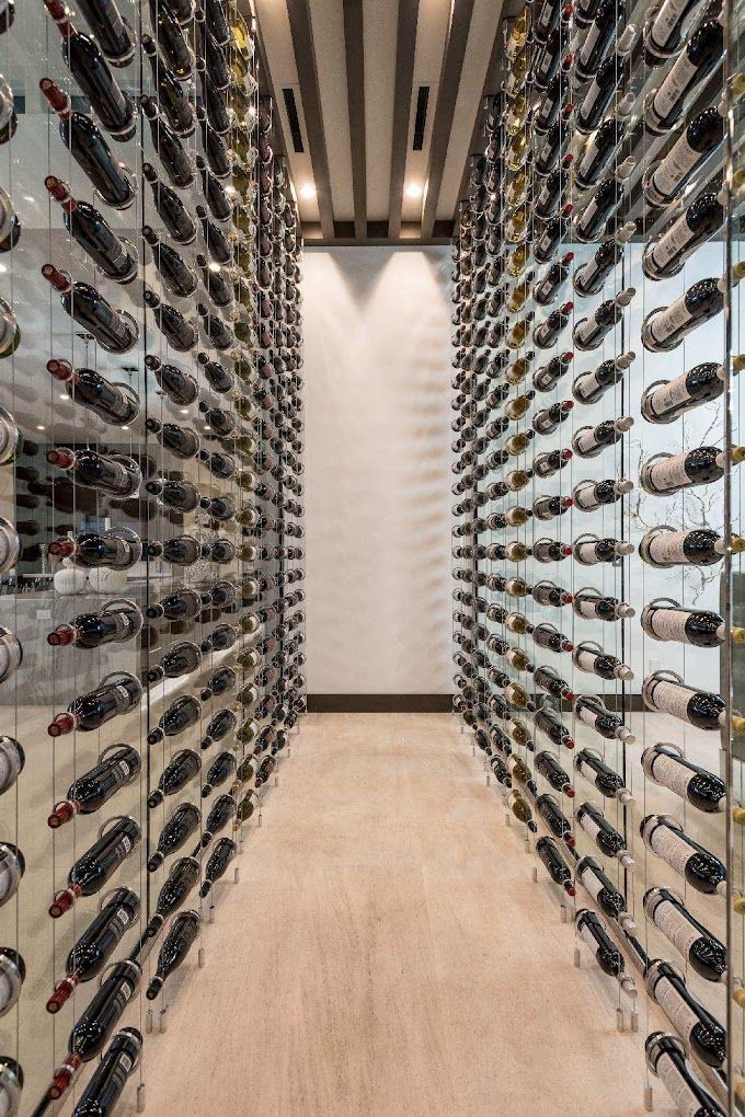 A wine cellar filled with lots of bottles of wine.