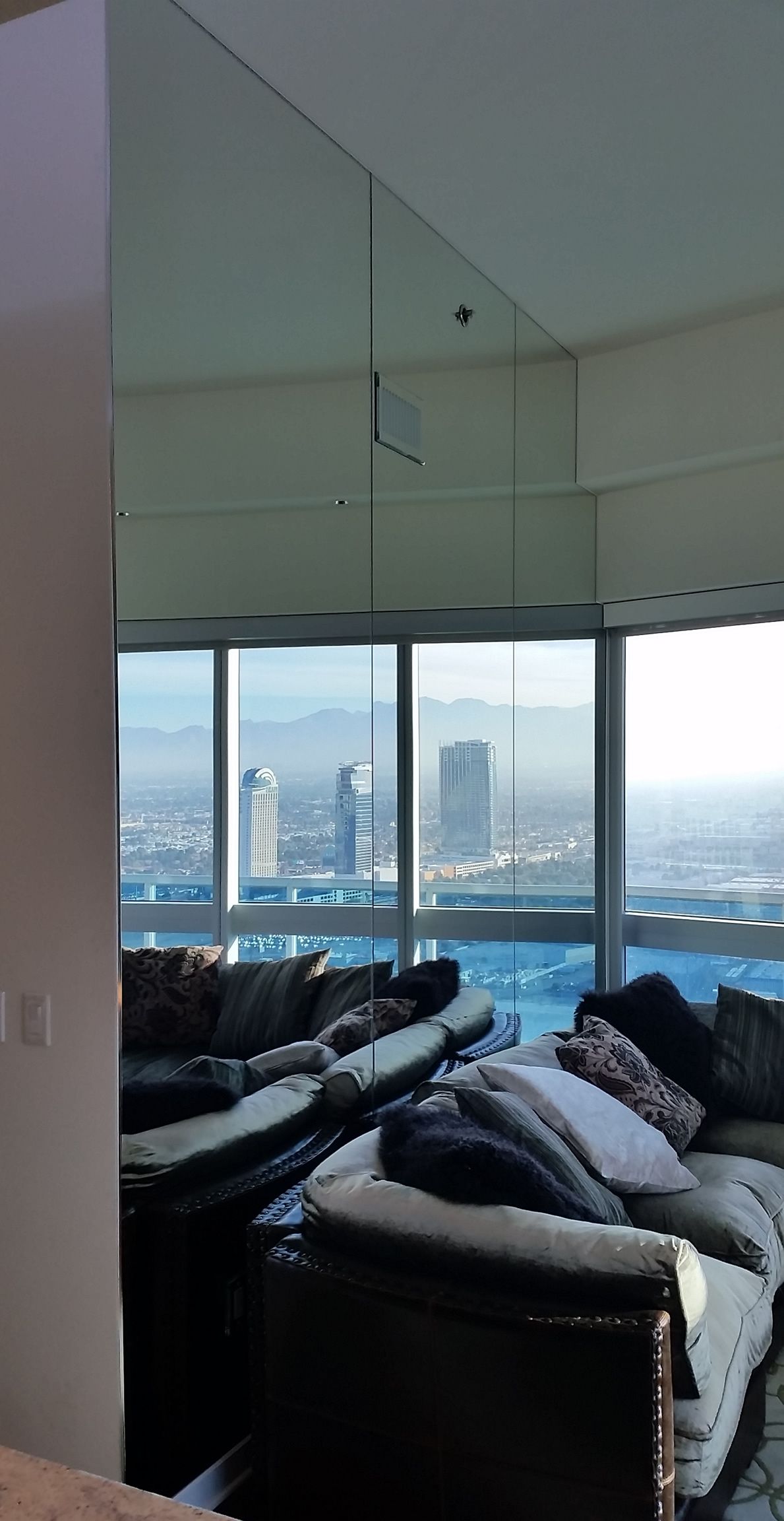 A living room with a lot of furniture and a large window