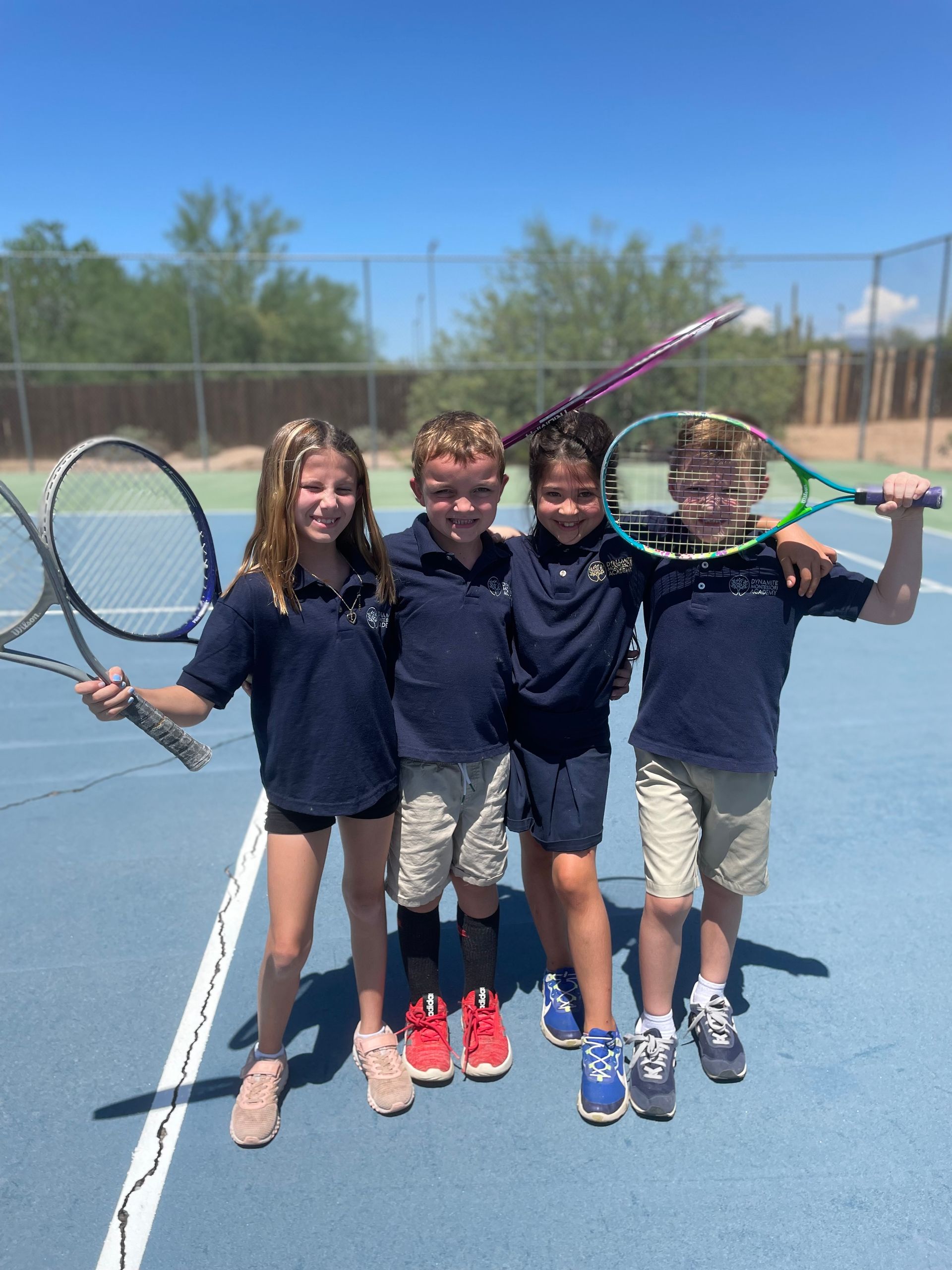 Montessori Elementary Kids Posing with Rackets