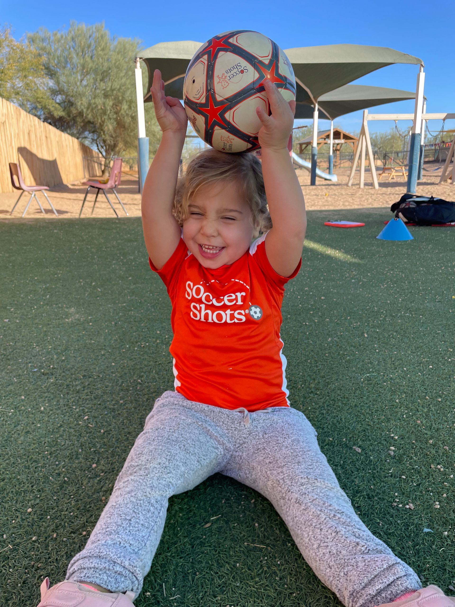Montessori child playing soccer