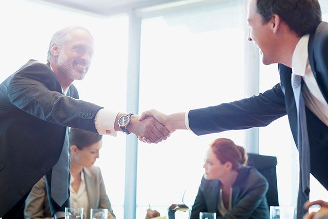 Businessmen Shaking Hands — Belchertown, MA — Law Offices of Richard H Maynard PC