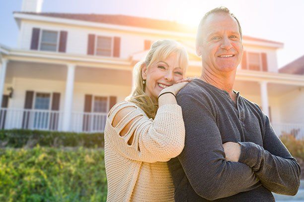 Couple In-front of their House — Belchertown, MA — Law Offices of Richard H Maynard PC