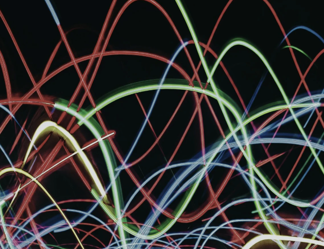 A bunch of colorful lights on a black background