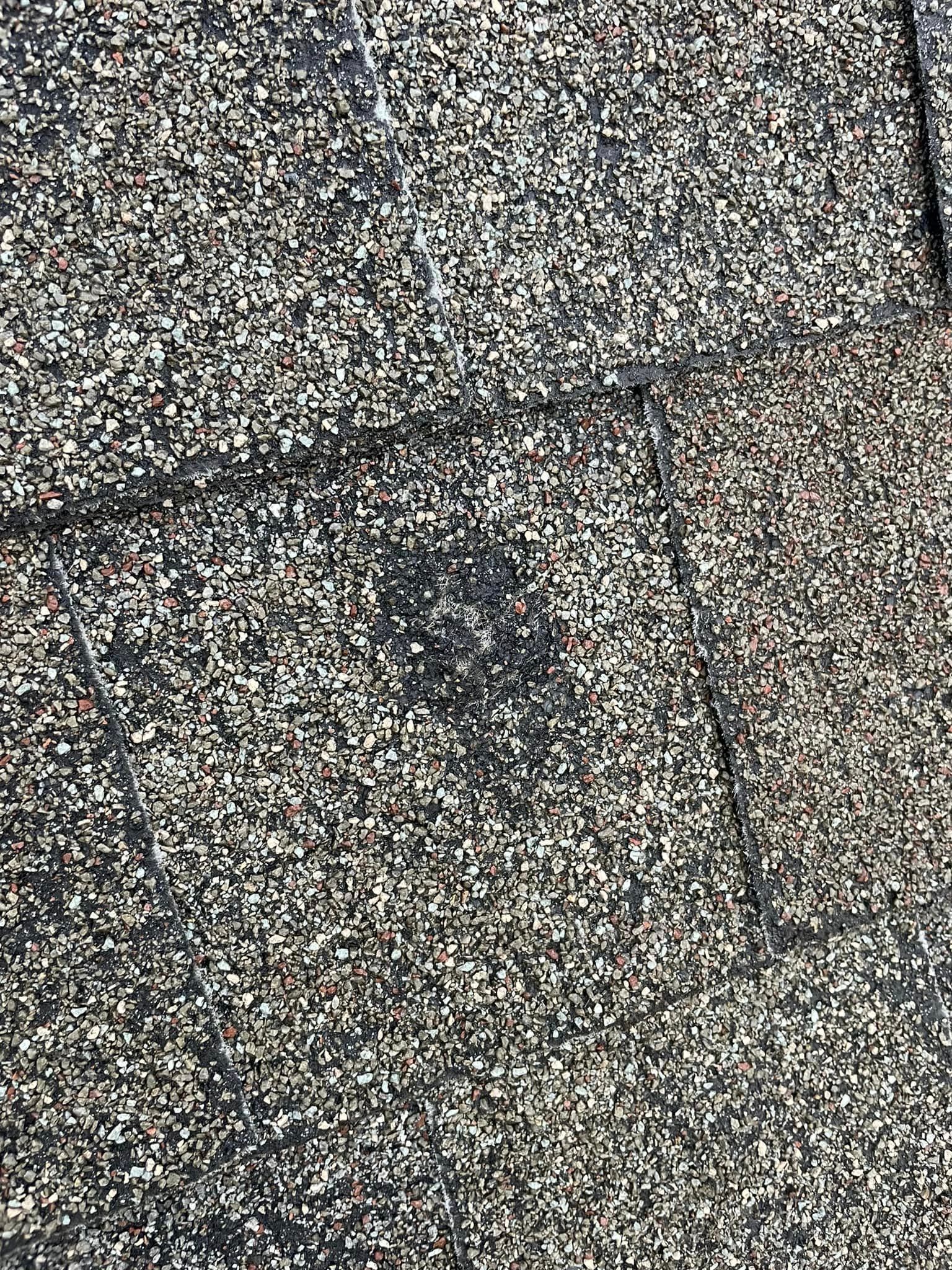 a close up of a roof with a hole in it .