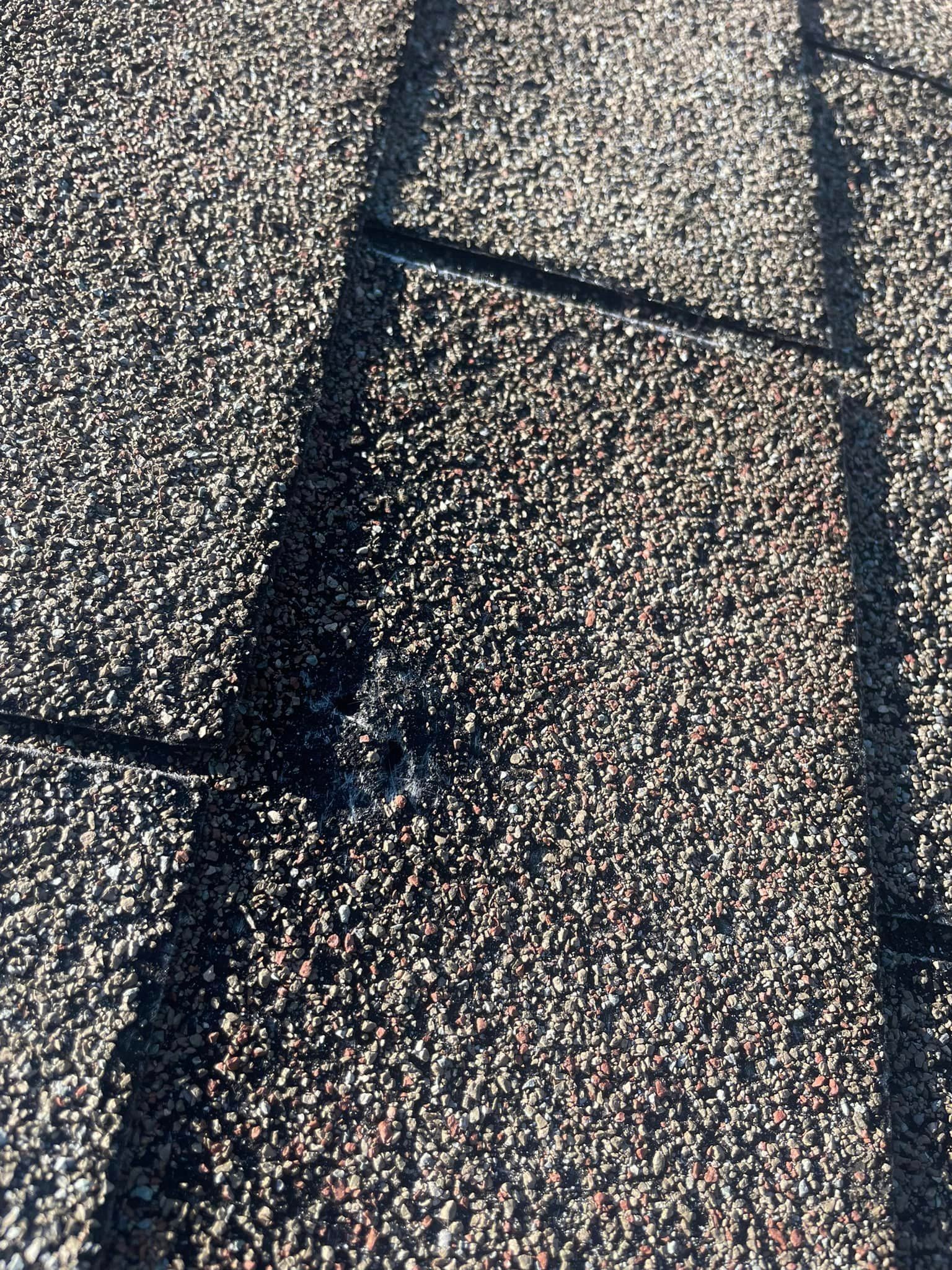 a close up of a roof with a hole in it .