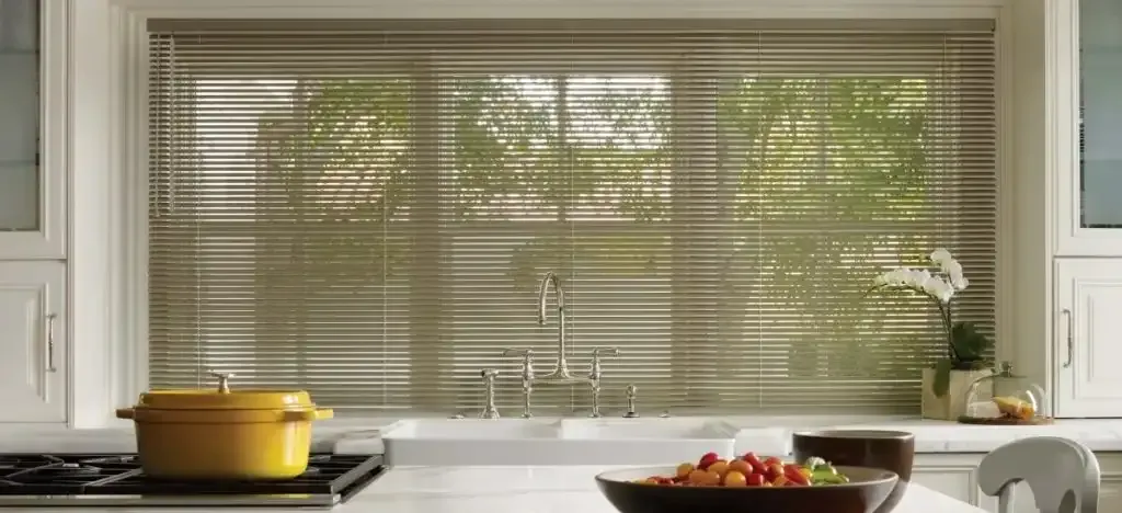 Kitchen with a window, blinds, and a white sink. A yellow pot sits on the stove, a bowl of food on the counter.