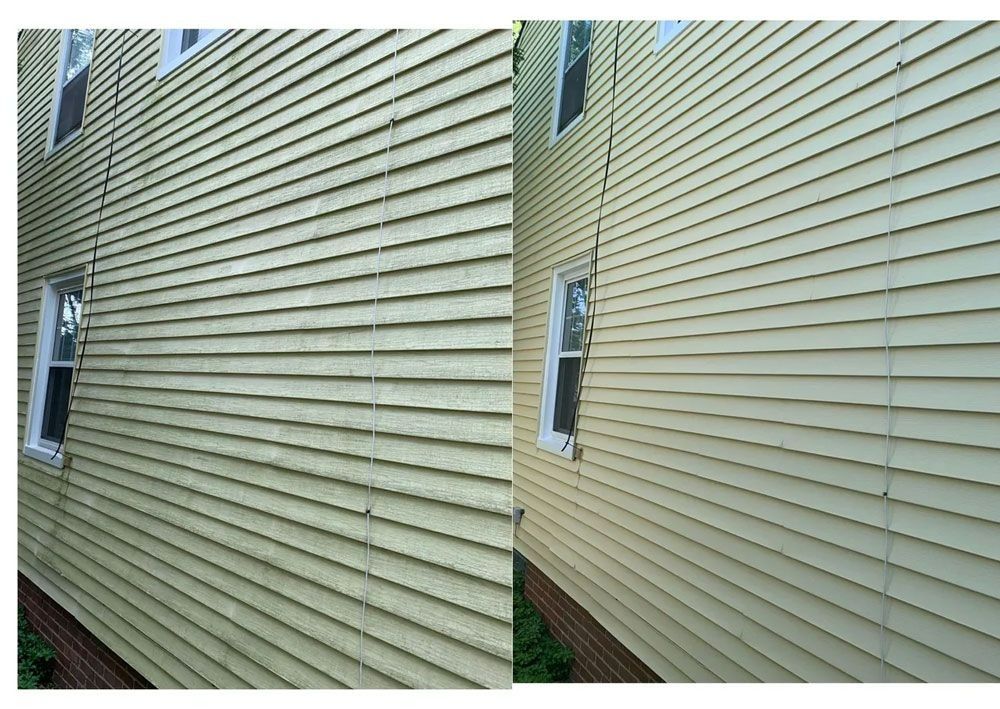 Side-by-side comparison of a green-yellow house siding before and after cleaning, showcasing dirt removal.
