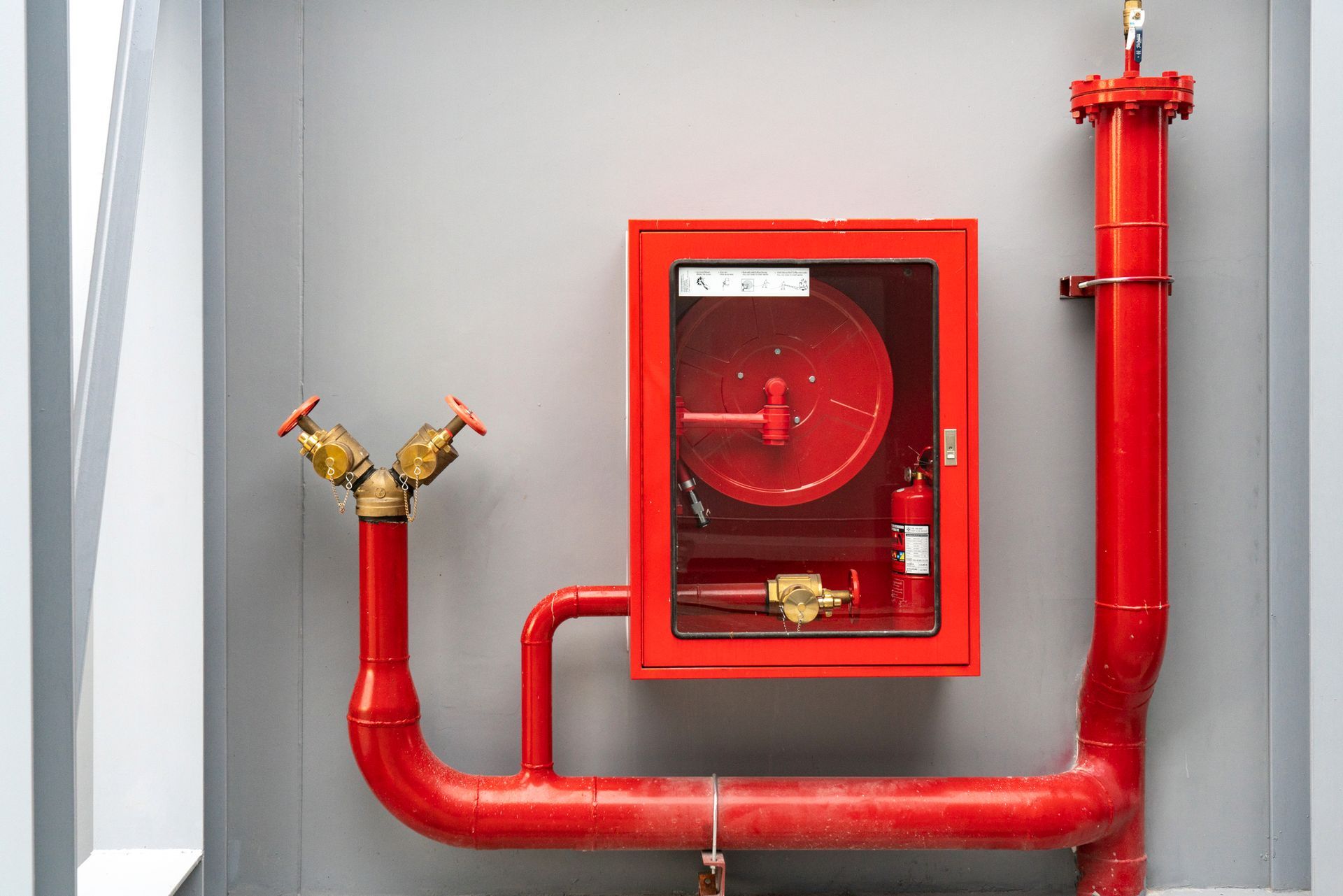 A red pipe with a glass box | Fire Suppression in Anchorage AK