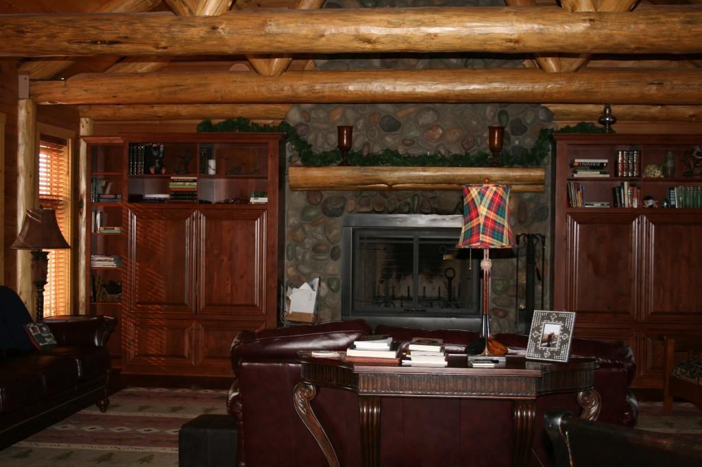 A living room filled with furniture and a fireplace