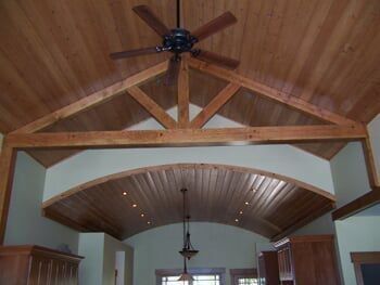 A ceiling fan is hanging from the ceiling of a house