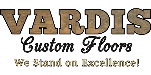 Logo for Vardis Custom Floors, featuring the text "VARDIS" in wood-grain lettering and the slogan "We Stand on Excellence!"
