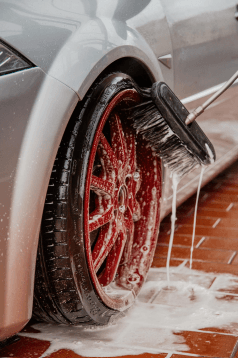 A thorough detailed cleaning of entire car exterior by a professional, including tires and rims washing