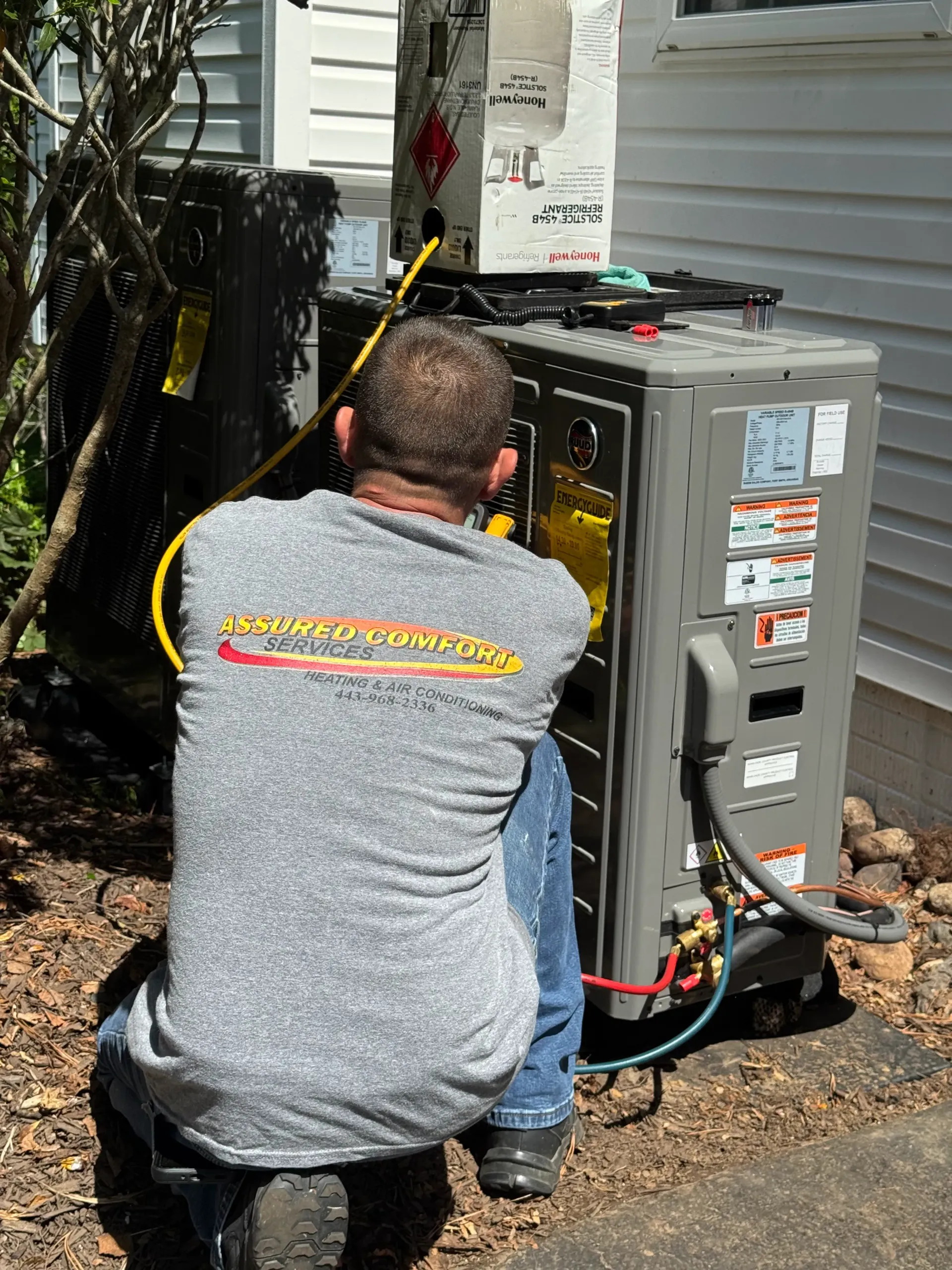 man repairing outdoor hvac unit