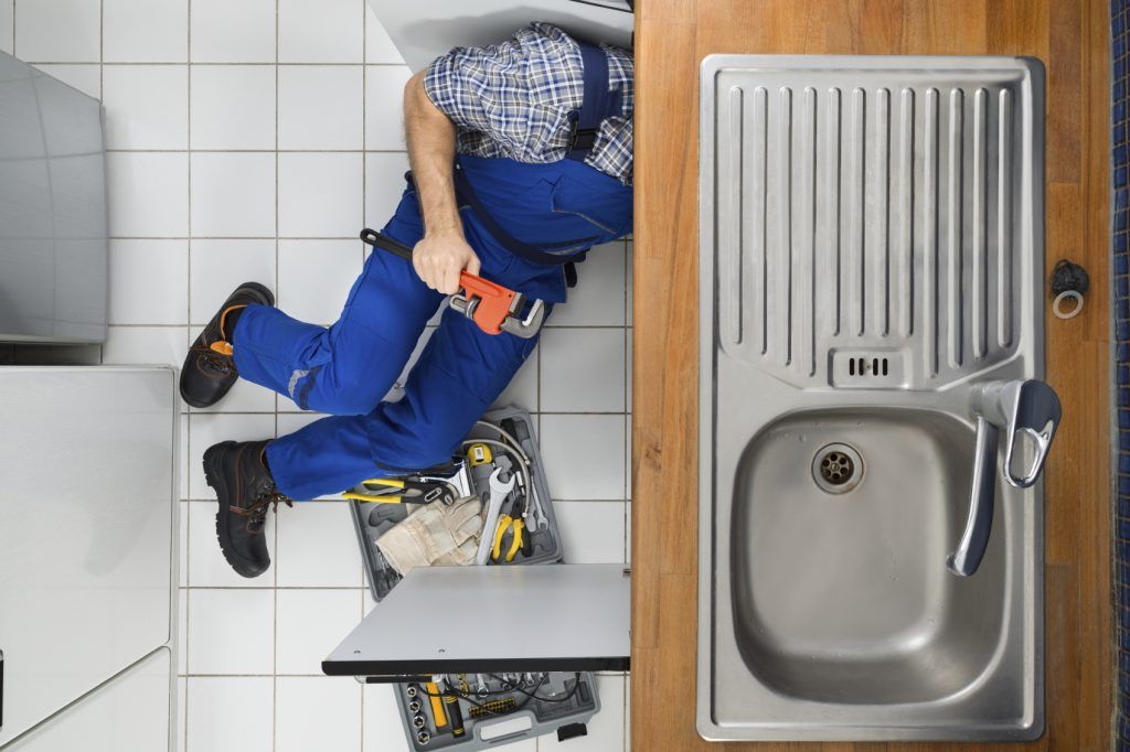 Plumber Fixing a Sink — Billings, MT — Rimrock Plumbing