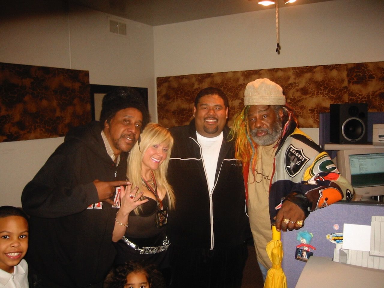 A group of people posing for a picture in a room