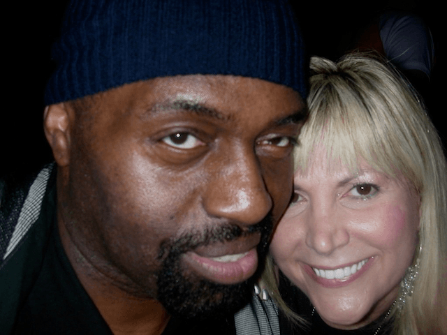 A man and a woman are posing for a picture together