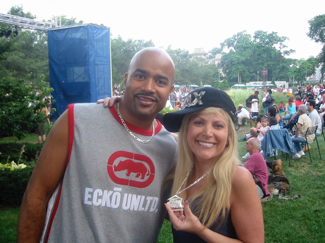 A man wearing an ecko unltd shirt poses with a woman