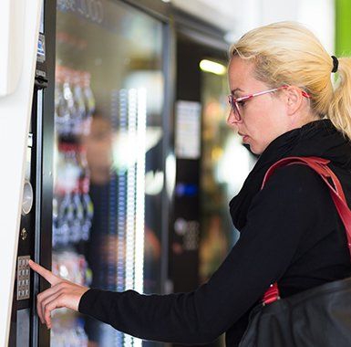 Vending Machines — Lady Using Modern Vending Machine in Jefferson, LA